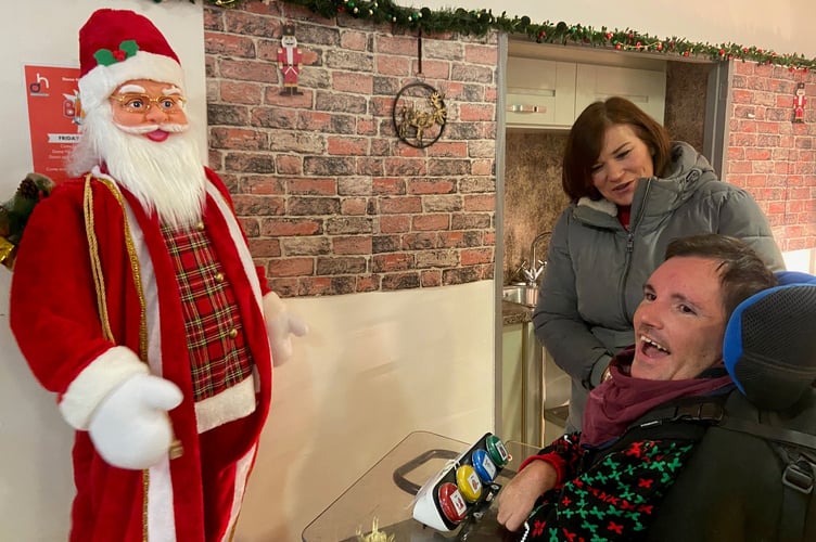 Dame Hannahs resident Josh with their families and friends